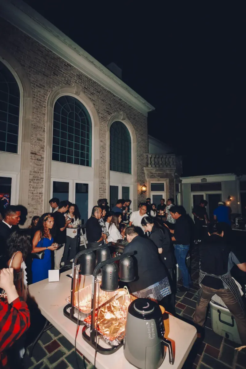 The courtyard full of guests at night, Visionaries 2025