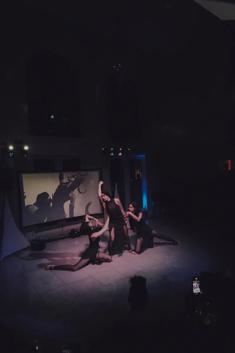 Dancers in silhouette against a projection, Visionaries 2025