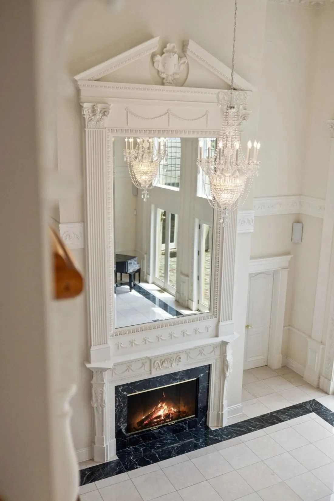 The two-story hall and fireplace at Beacon Hill Manor